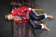Sexy Sandra wearing sexy red/blue rainwear being tied and gagged with ropes and a clothgag on a chair (Pics)