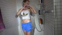 SEXY SANDRA in the shower with a sexy lightblue shiny nylon shorts and a top (Video)