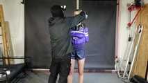 Myxxxy tied and gagged in shiny nylon Shorts and Windbreaker