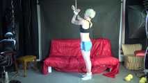 Watching ***NEW MODELL COURTNEY*** wearing a sexy lightblue shiny nylon shorts and a black top being tied and gagged overhead with ropes and a ballgag (Video)