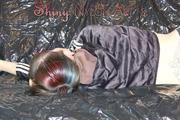 Mara wearing a supersexy black shiny nylon shorts and a super short belly rain jacket lolling on a white sofa (Pics)