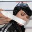 Jill bound and gagged in a shiny pvy sauna suit