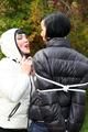 Jill ties her friend in shiny downjackets