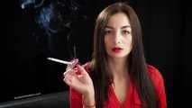 Gorgeous maneater Marina is smoking a 120mm with a short cigarette holder