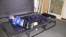 Lana tied and gagged in shiny nylon Rainwear desperately trying to free herself