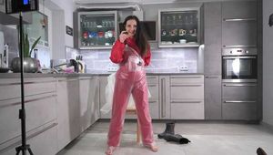 Miss Amira in red nylon rain gear and tranparent rain suit