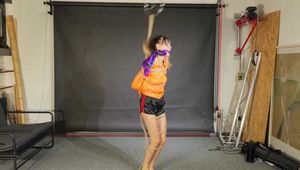 Lana bound and gagged in shiny Shorts and Windbreaker 