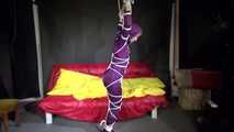 Watching sexy Sonja wearing a supersexy purple shiny nylon rainwear combination being tied and gagged overhead with ropes and a clothgag (Video)