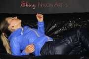 Sexy Sandra wearing a supersexy black shiny nylon rain pants and a sexy shiny blue rain jacket lolling on the sofa (Pics)