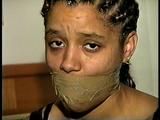 18 Yr OLD STUDENT SHANNA IS WRAP TAPE GAGGED, DUCT TAPE TIED, BAREFOOT, TOE-TIED, HANDCUFFED, MOUTH STUFFED, HANDGAGGED WHILE SITTING ON THE BED (D67-15)