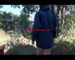 Mara wearing only a hot rain jacket and rubber boots lingering in the garden taking a shower (Video)