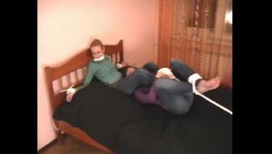 Catt and Alexa - Naughty girl tied up before joining powerless girlfriend on the bed (video)