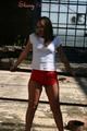 Stella posing outdoor wearing a supersexy red shiny nylon shorts and a white top (Pics)