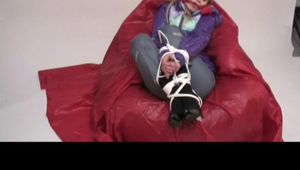 02:50 video with Samantha bound and gagged in a shiny nylon downjacket