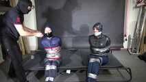 Aiyana and Ms Ungeniert bound and gagged in shiny nylon Rainwear