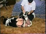 BOUND IN BLACK PANTIES, DRESS, GARTER BELT, HEELS & CLEAVE GAG SUZIE (D24-14)