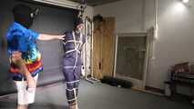 Myxxxy bound and gagged in a shiny nylon Rainsuit
