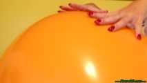 red fingernail popping of seven balloons