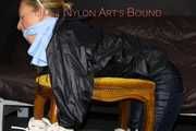 Watching sexy Sandra wearing a sexy blue shiny nylon pants and a rain jacket being tied and gagged with ropes and a clothgag on a stool (Pics)