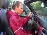 Watch Sandra taking a Walk during very hot Weather enjoying her rubberized oldschool Rainsuit