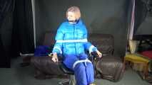 Sexy Pia being tied and gagged with ropes and a cloth gag on a hairdressers chair wearing a sexy blue shiny nylon rainpants and a lightblue downjacket (Video)