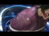 Video with Jill tied and gagged in a shiny purple semi transparent PVC suit