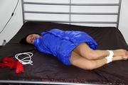 Simone tied and gagged in a shiny nylon downcoat
