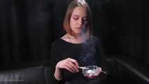 Dasha is smoking in the studio