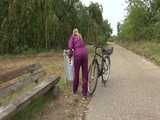 Get a Video with Sandra riding her bike enjoying her shiny nylon Rainwear