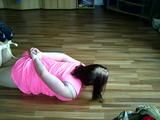 Sandra hogtied on the floor