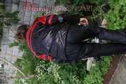 Watching sexy Sandra wearing a oldschool black/red shiny nylon rainwear combination while gardening outside (Pics)