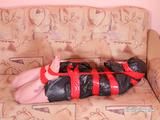 [From archive] Liska overhead trash bag packed with red duct tape