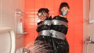 Anni Bay and Dakota - the pair in trash bags in the shower