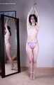 Tracy: topless barefoot girl with noose on her neck, having her to stand on her tip toes to breathe, is tickled by camera man
