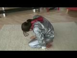Video with Alina tied and gagged in a shiny pvc sauna suit