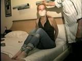 . 41 Yr OLD RED HEADED FAMOUS FASHION MODEL IS OTM GAGGED, BAREFOOT, TOE-TIED, HOPS AROUND ROOM, TIES, GAGS AND HANDCUFFS HERSELF WHILE WEARING BLUE JEANS  PT 8  (D60-5)