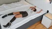 Spread eagle on bed