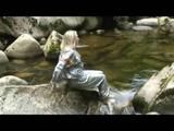 Sophie enjoying the water and weather on a river wearing supersexy grey sauna pvc rainwear (Video)
