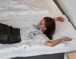 Spread eagle on bed