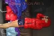 Watching sexy Stella and Sandra wearing a sexy shiny nylon shorts putting on several chiny nylon down jackets (Pics)