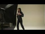 Stella posing infront of the camera wearing supersexy black rainwear and highheels (Video)