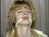 CUTIE FACE TERRI IS BAREFOOT, BALL-GAGGED, TIT TIED, CLEAVE GAGGED & TOE TIED (D47-10)