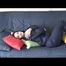 Jill DIamond lolling on a sofa wearing supersexy shiny rainwear (Video)