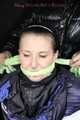 Sexy Mara wearing a black rain pants and a blue/black down jacket being tied, gagged and hooded with tape and clothgag (Pics)
