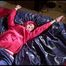 Sonja tied and gagged on bed with cuffs wearing a sexy rainwear combination (Video)