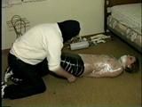 TAPE WRAPPING UP A LITTLE DOLL (D10-2)