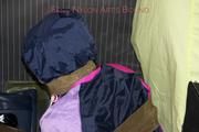 Jill tied and gagged in shiny nylon rainware