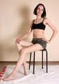 Emily bound with rope, sittin on the stool