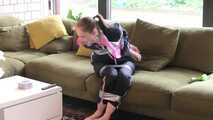 Rachel Adams bound and gagged by an Intruder in shiny Rainwear