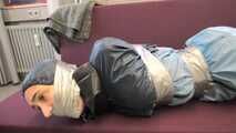 Rey Sanson bound and gagged in a shiny nylon Rainwear gets Pants ripped of